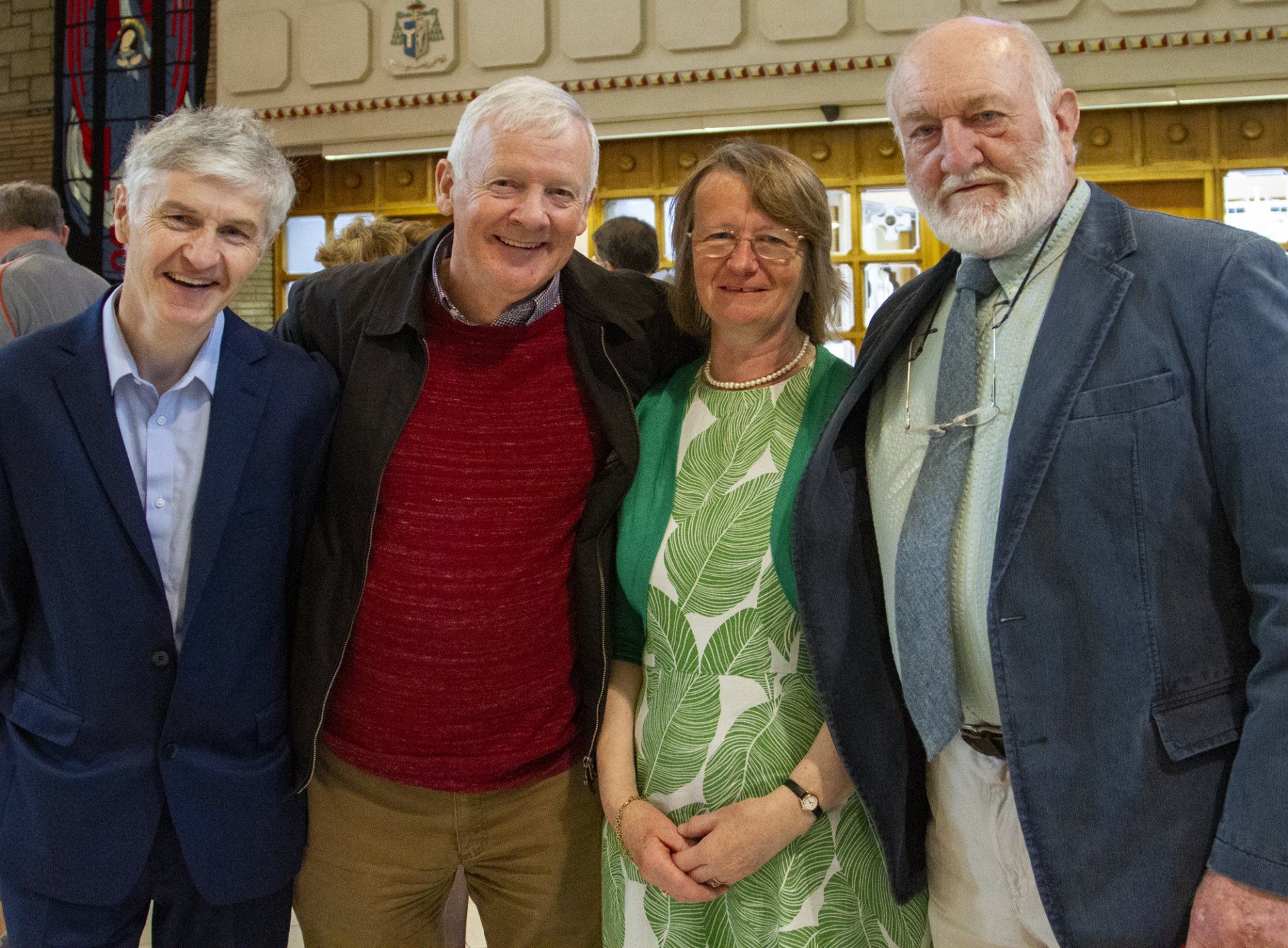 A group of four people posing for a picture together
