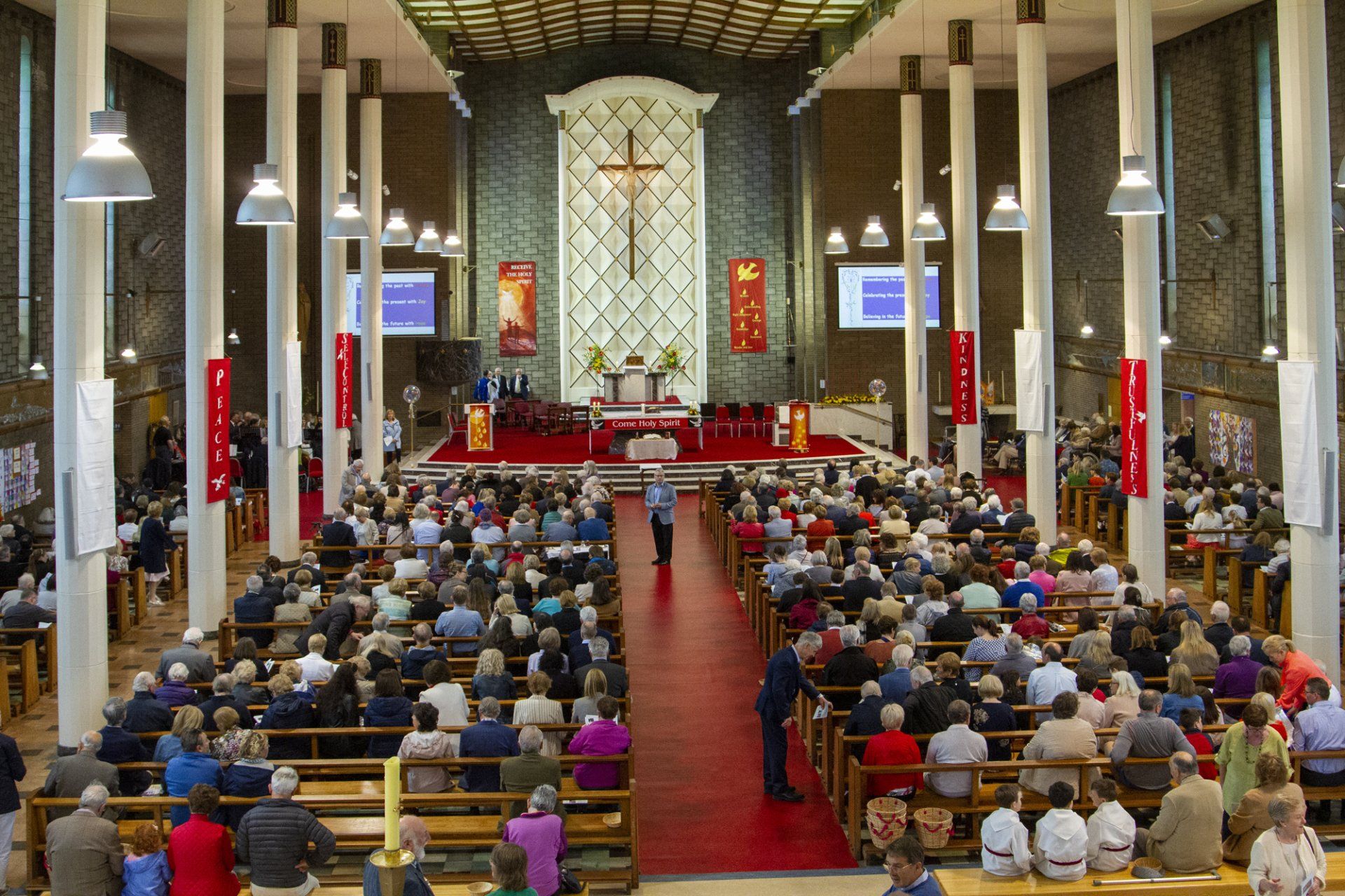 A large group of people are sitting in a church