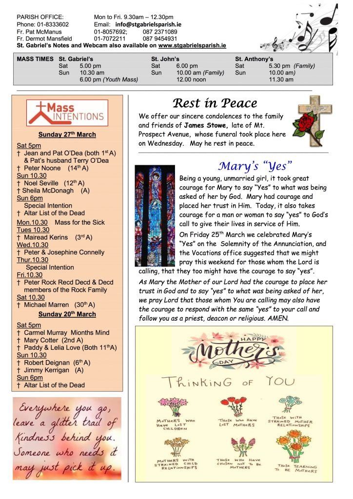 A newspaper with a picture of a stained glass window and a cross on it.