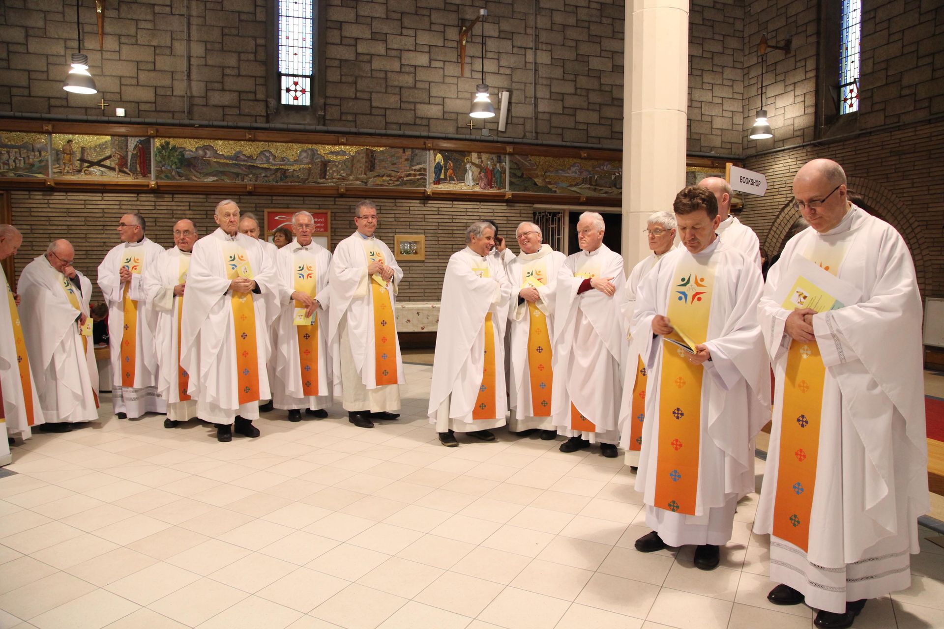 A group of priests are standing in a church