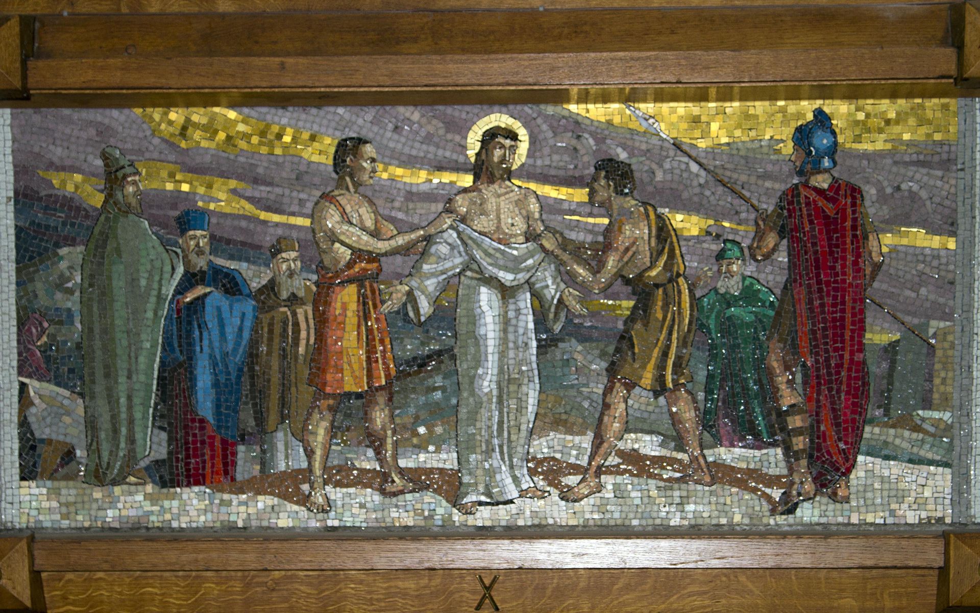 A mosaic painting of jesus being nailed to the cross