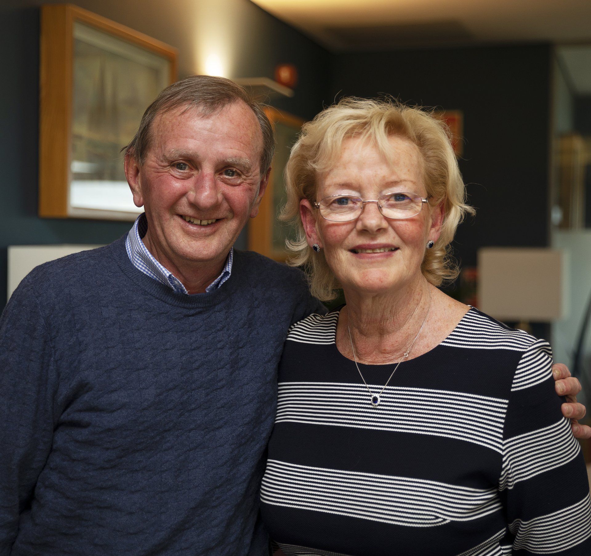 A man and a woman are posing for a picture together