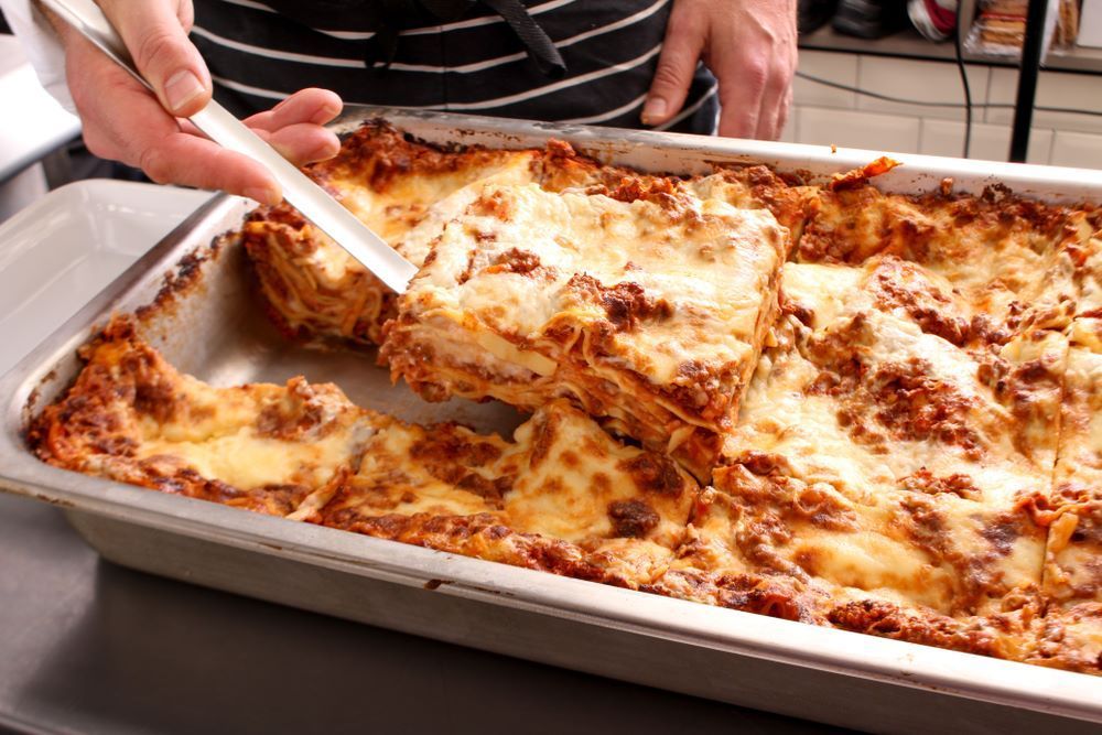 A Close Up of a Plate of Food on a Wooden Table — Michelangelos Pizza & Pasta in  Kelso, NSW