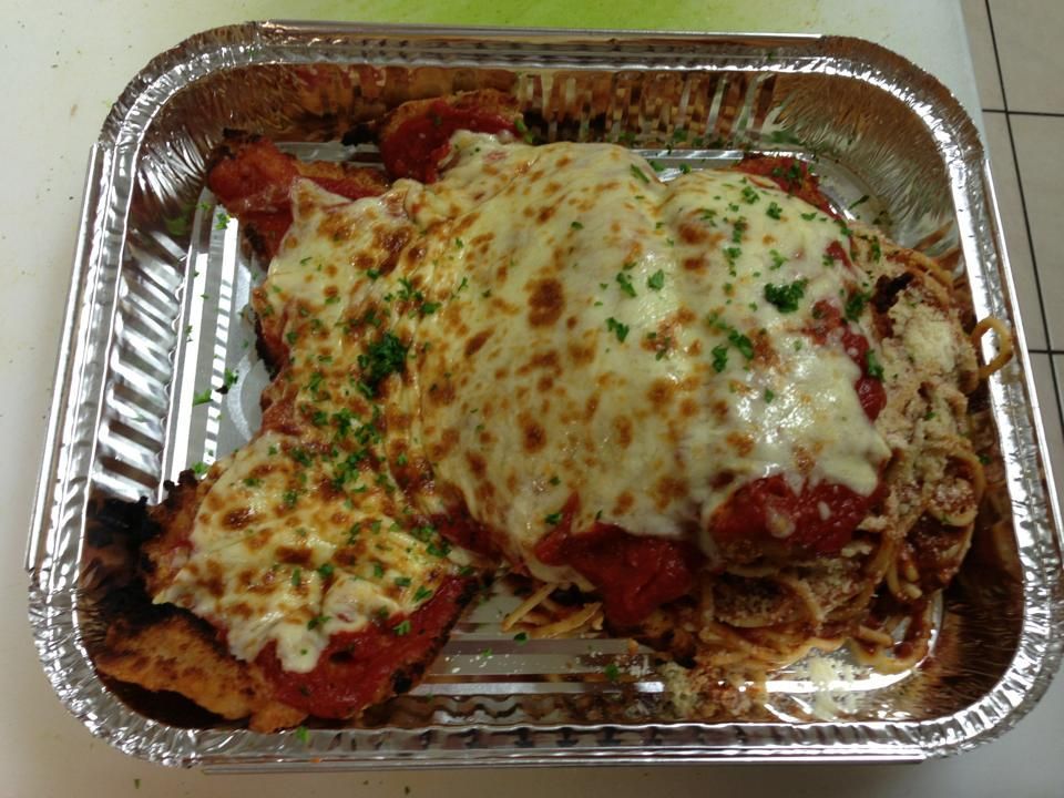 A Foil Container Filled With Chicken Parmesan and Spaghetti — Michelangelos Pizza & Pasta in  Burdell, QLD