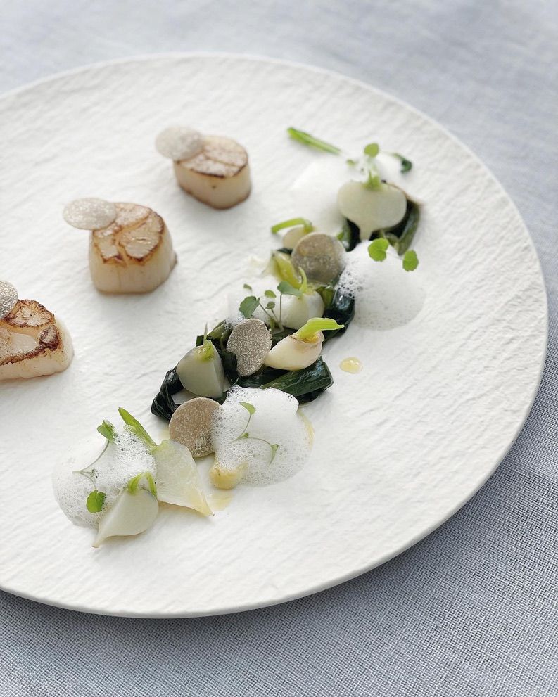 A close up of a plate of food with sauce on it