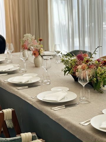 A large room with tables and chairs in it