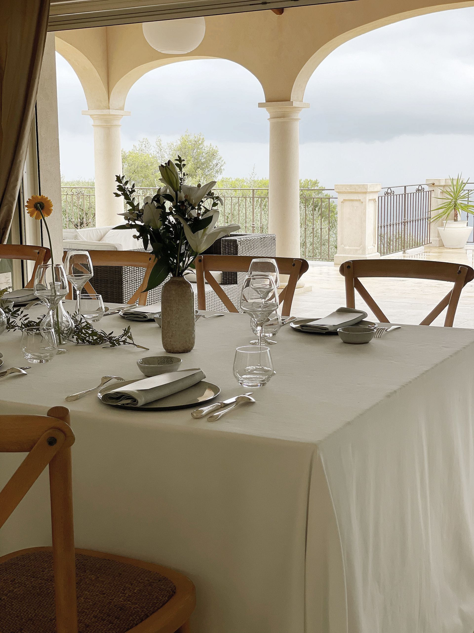 A table with a vase of flowers on it
