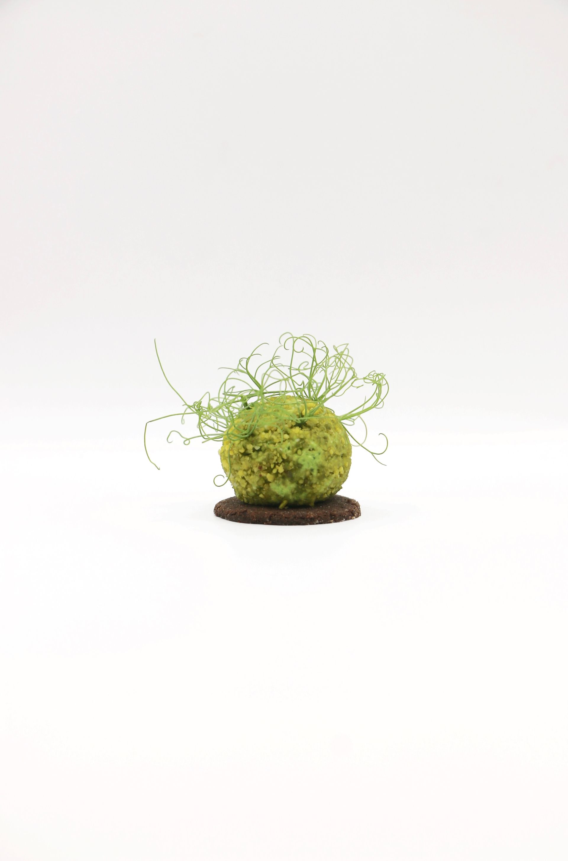 A table topped with bowls of fruit and flowers.