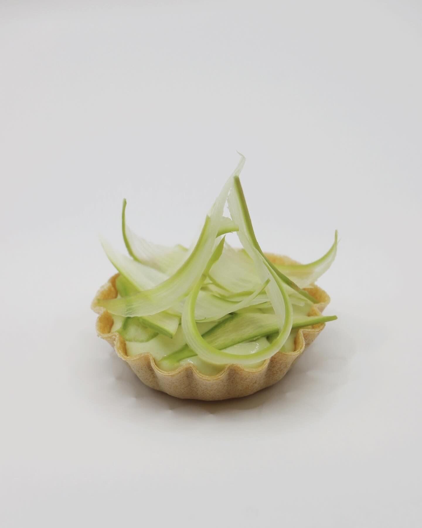A table with a lot of food on it under a tent