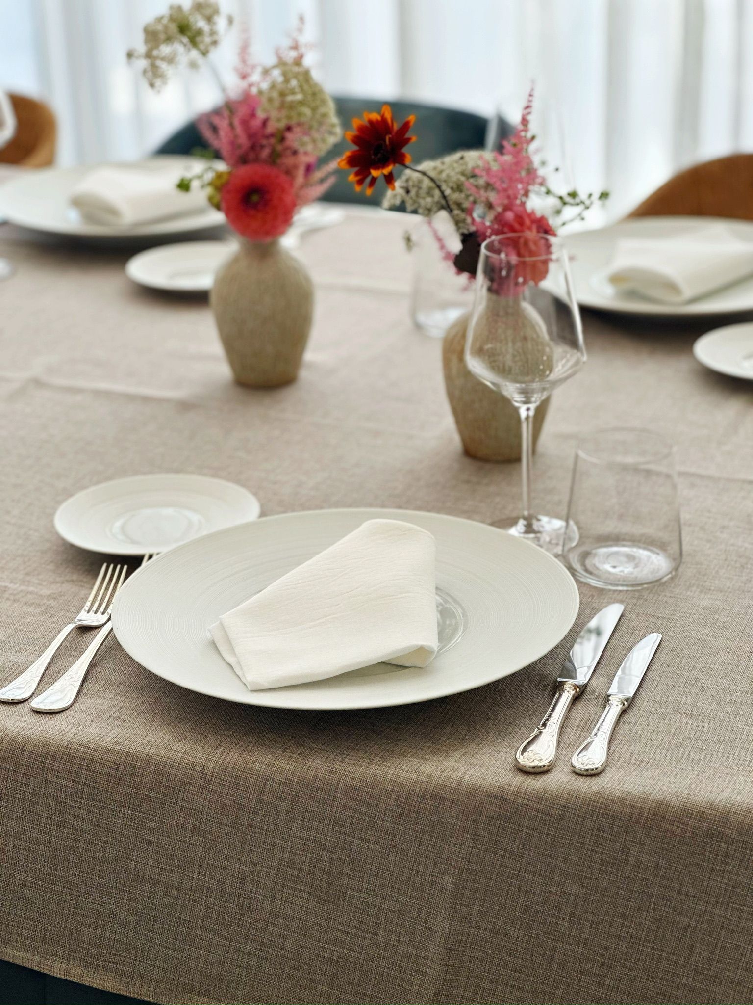 A kitchen with stainless steel appliances and wooden floors