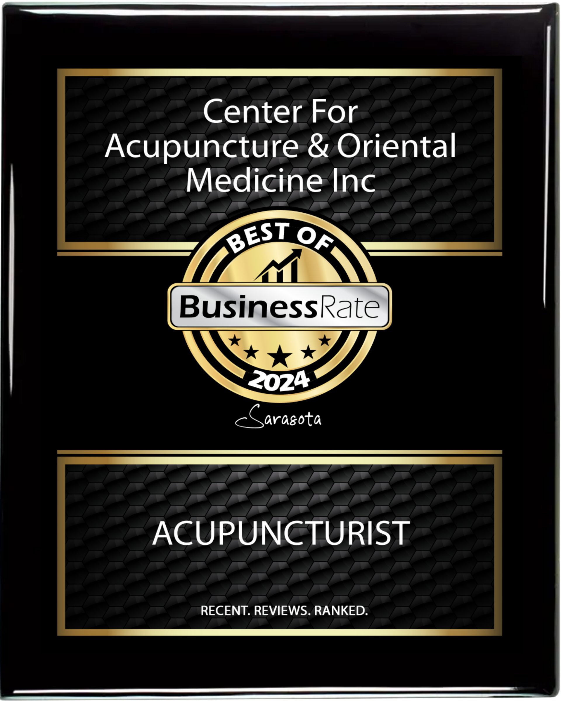 A black and gold plaque for center for acupuncture & oriental medicine inc
