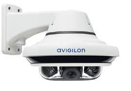 White Avigilon surveillance camera mounted on a wall bracket.
