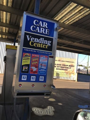 A Car Care Vending Machine Is Sitting Under A Roof — Emerald Car Wash In Emerald, QLD