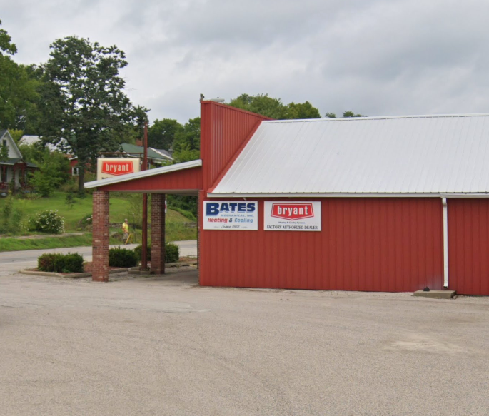 A red building with a sign that says bates on it