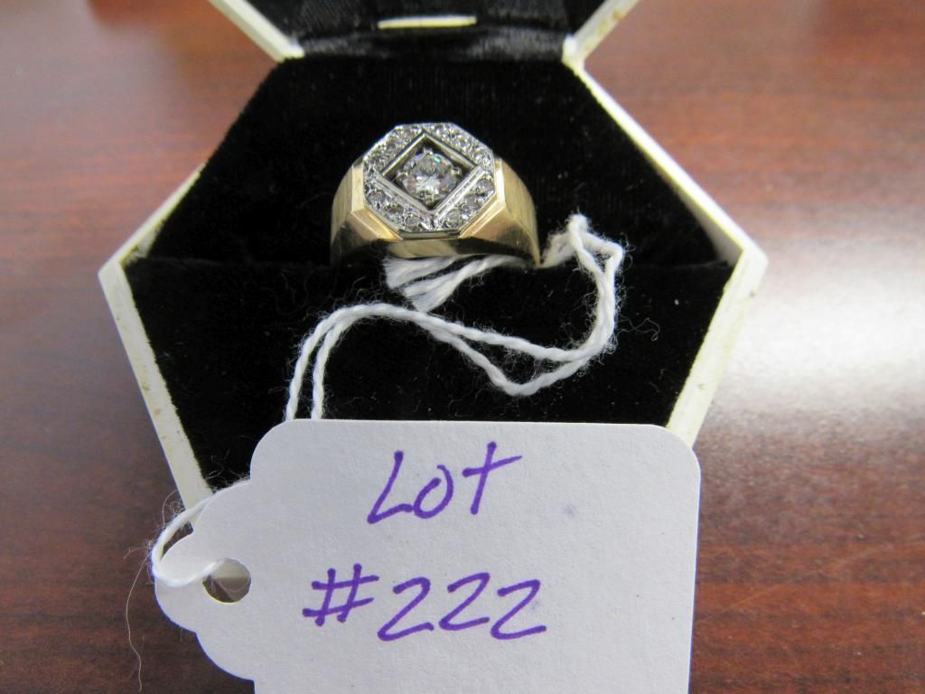 Gold ring with square gemstone in a black jewelry box, tagged “Lot #222”