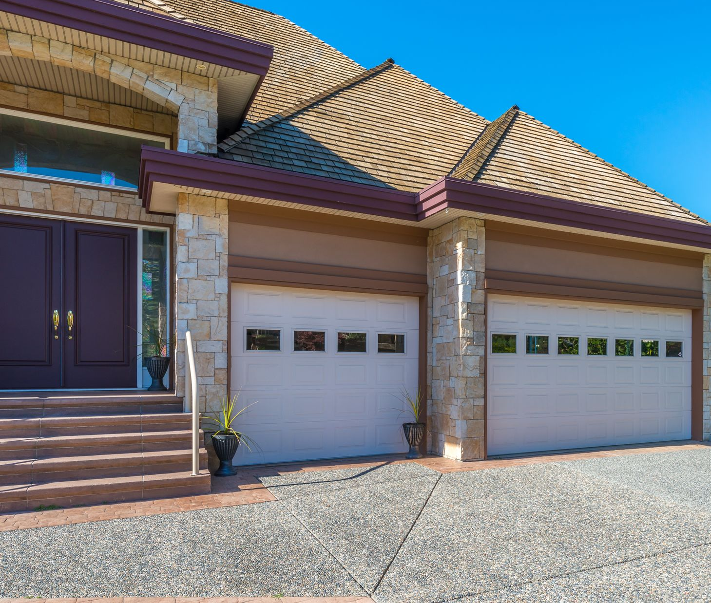 A group of construction workers are working on a concrete walkway.