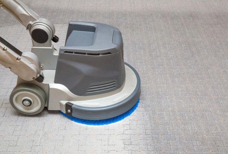Floor Cleaning Machine With a Spinning Blue Brush, on a Carpet — Mo Property Cleaning in Wright, ACT