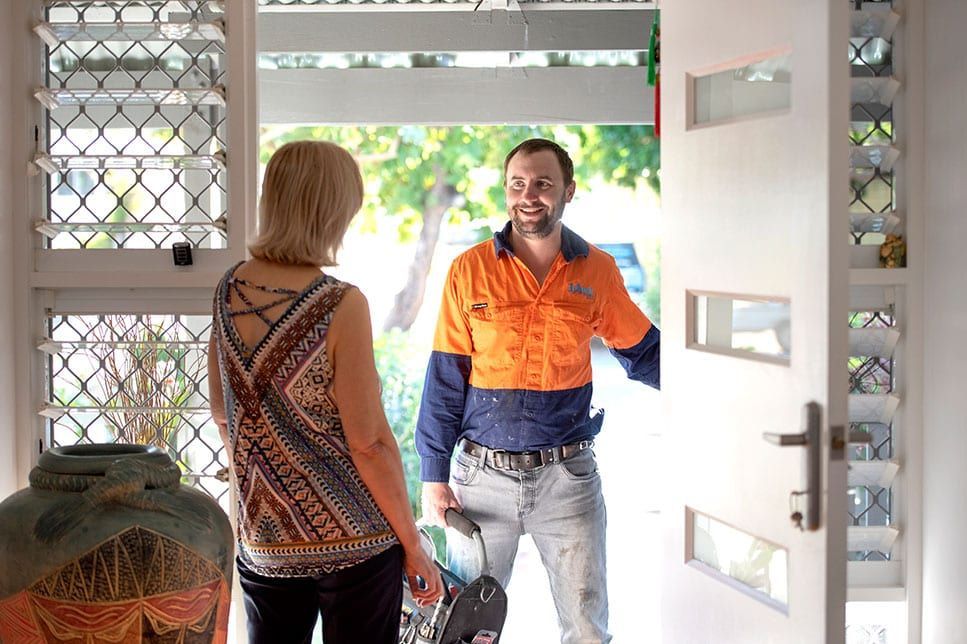 Plumber At Front Door — Plumbing In Gulliver, QLD
