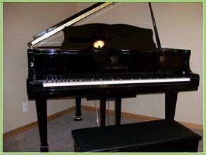 For piano tuition in Glamorgan call 01792 873 991 A grand piano