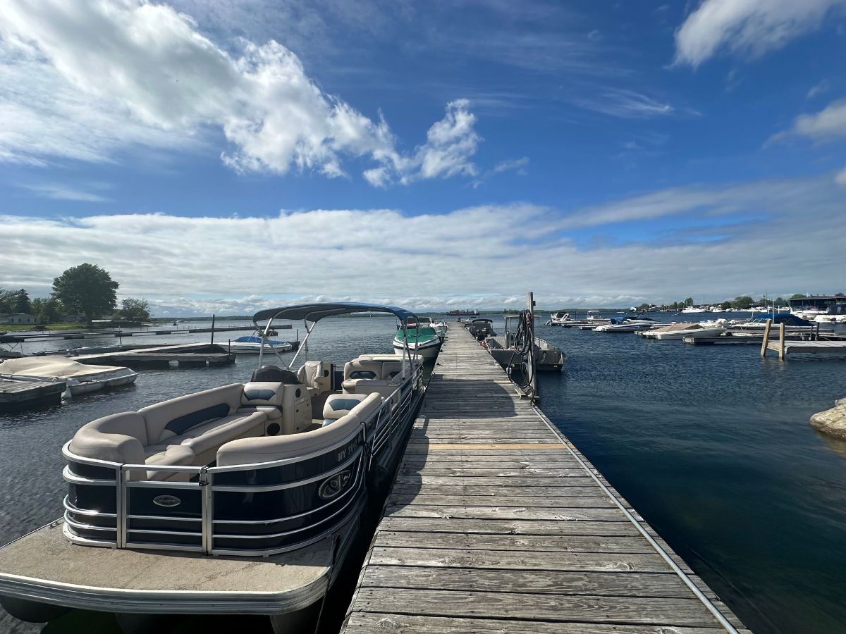 A kitchen with a table and chairs and a checkered tablecloth.