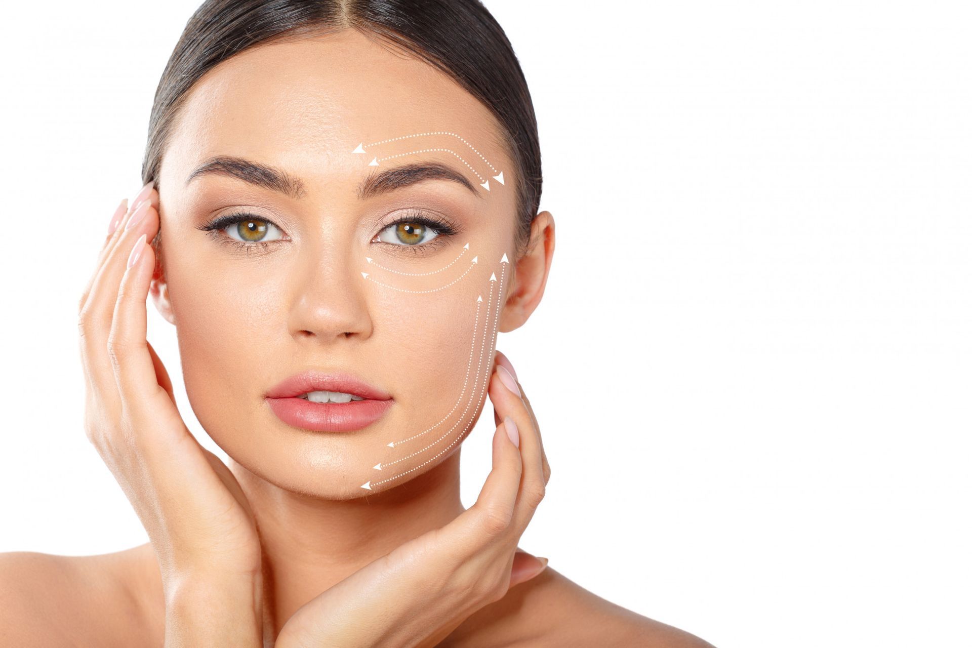 A woman is touching her face with her hands and there are lines on her face.