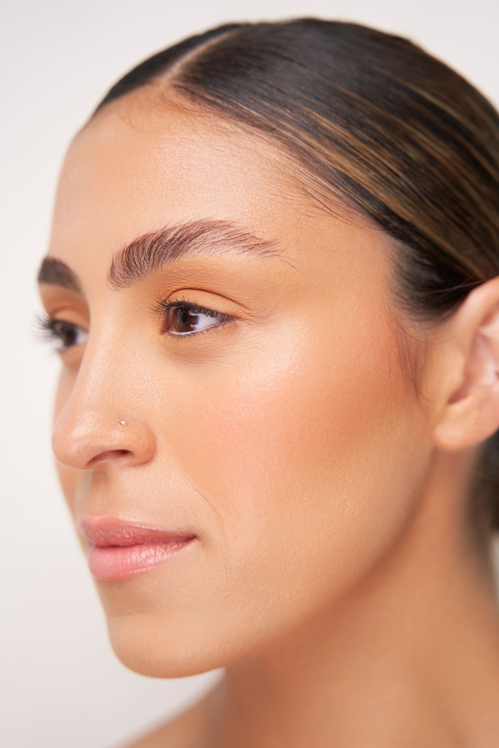 A close up of a woman 's face with makeup on.