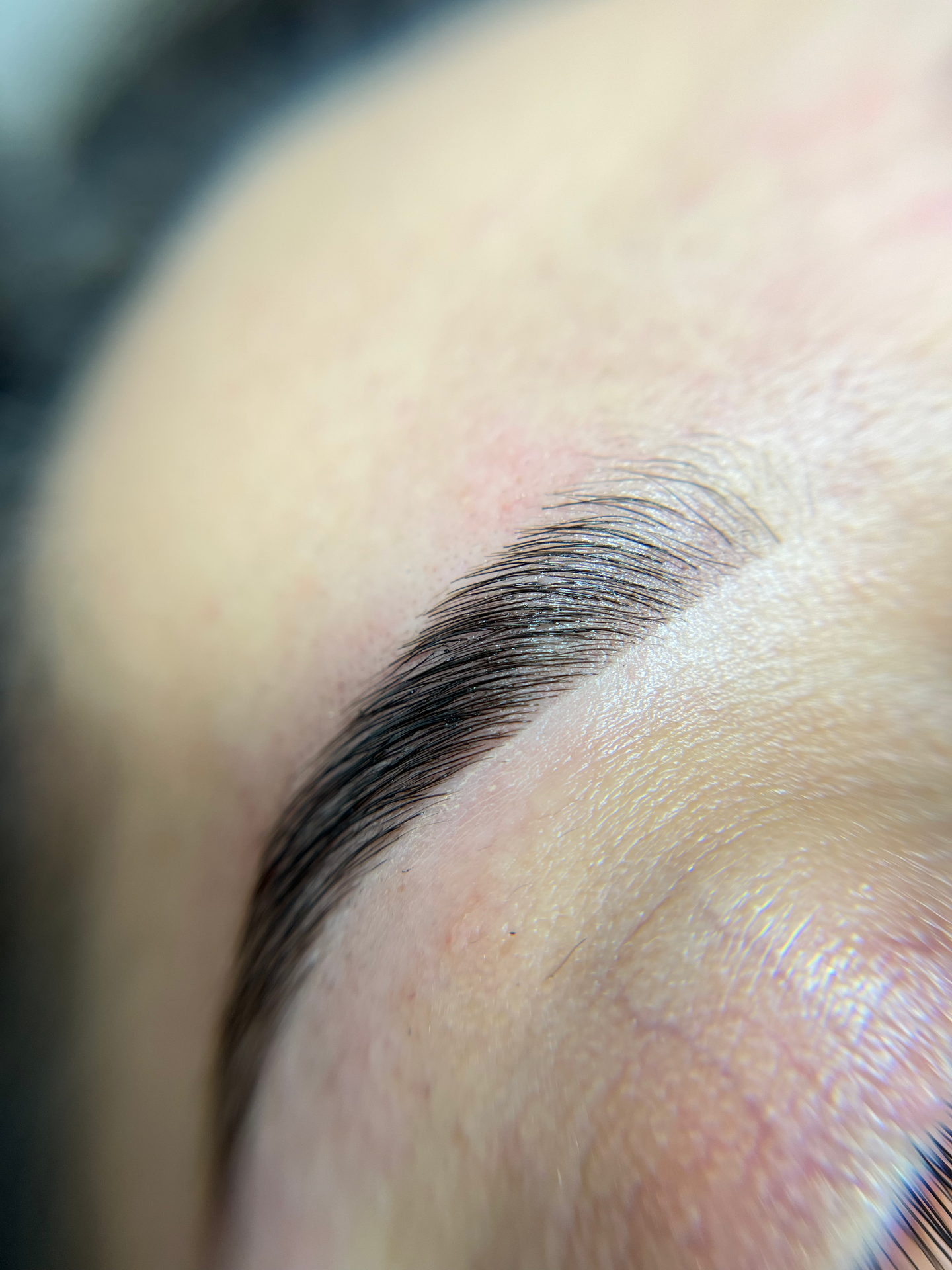 It is a close up of a woman 's eyebrow.