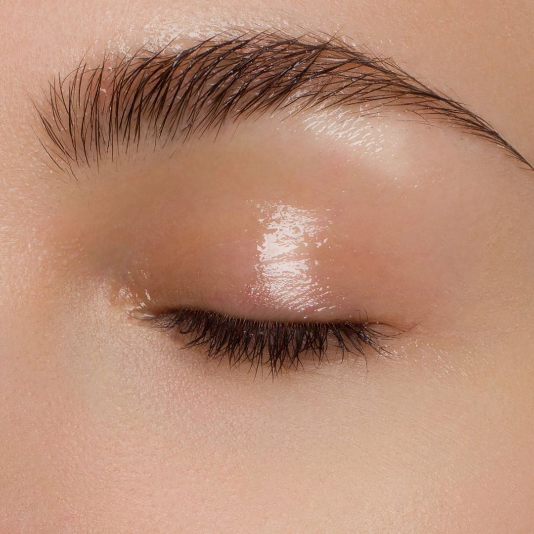 A close up of a woman 's eye with makeup on it.