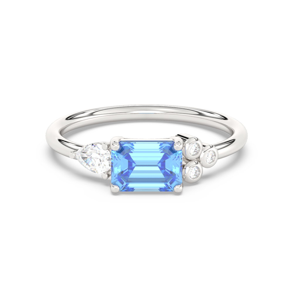 Zilveren ring met blauwe rechthoekige edelsteen, peervormige en ronde diamanten.