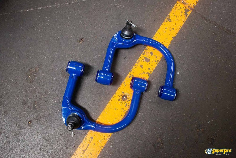 A Pair of Blue Arms Are Sitting on A Yellow Line — Currajong Brake Parts Pty Ltd In Currajong, QLD