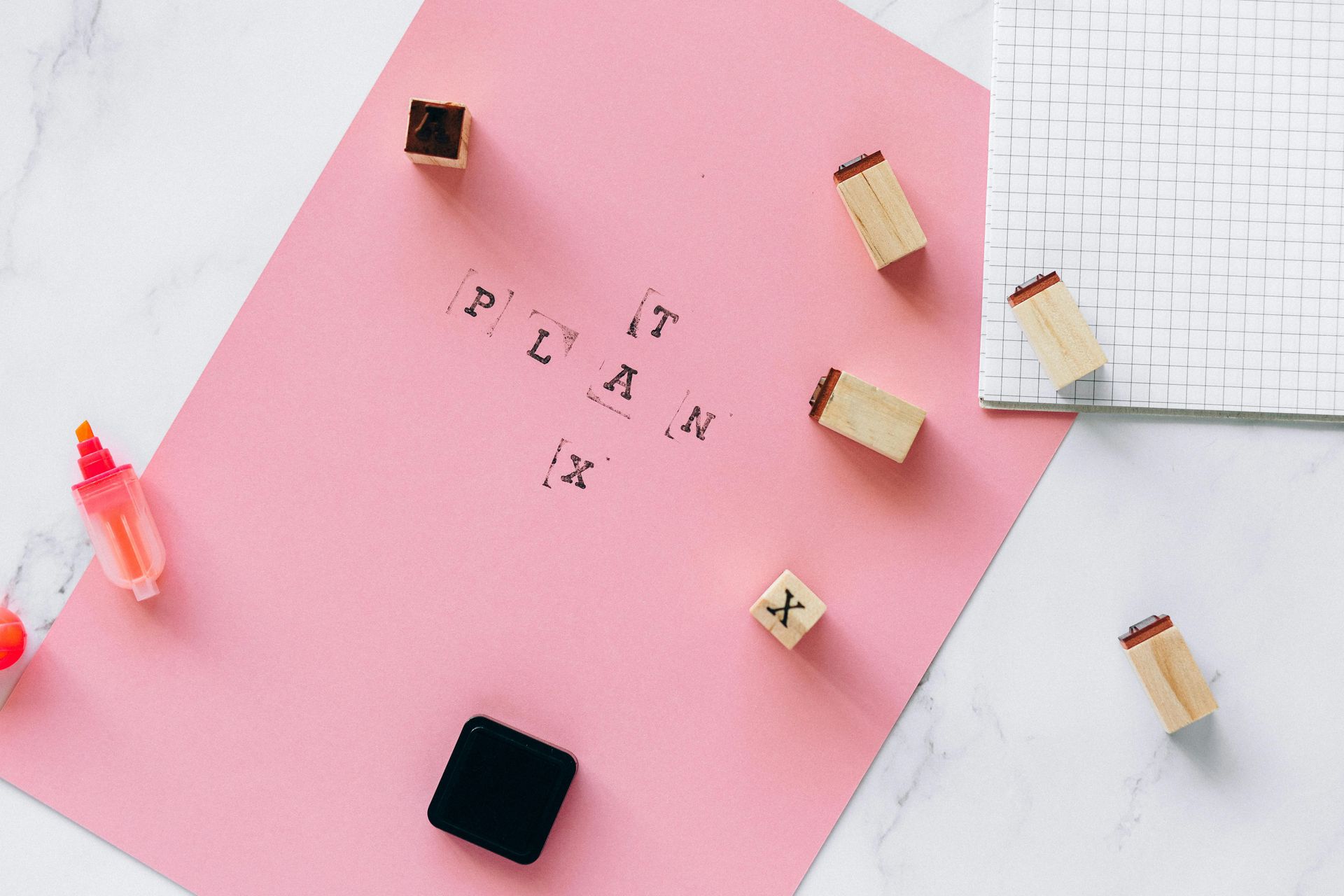 Plan tax note with stationery and graph paper – VAT return support for small businesses in Surrey