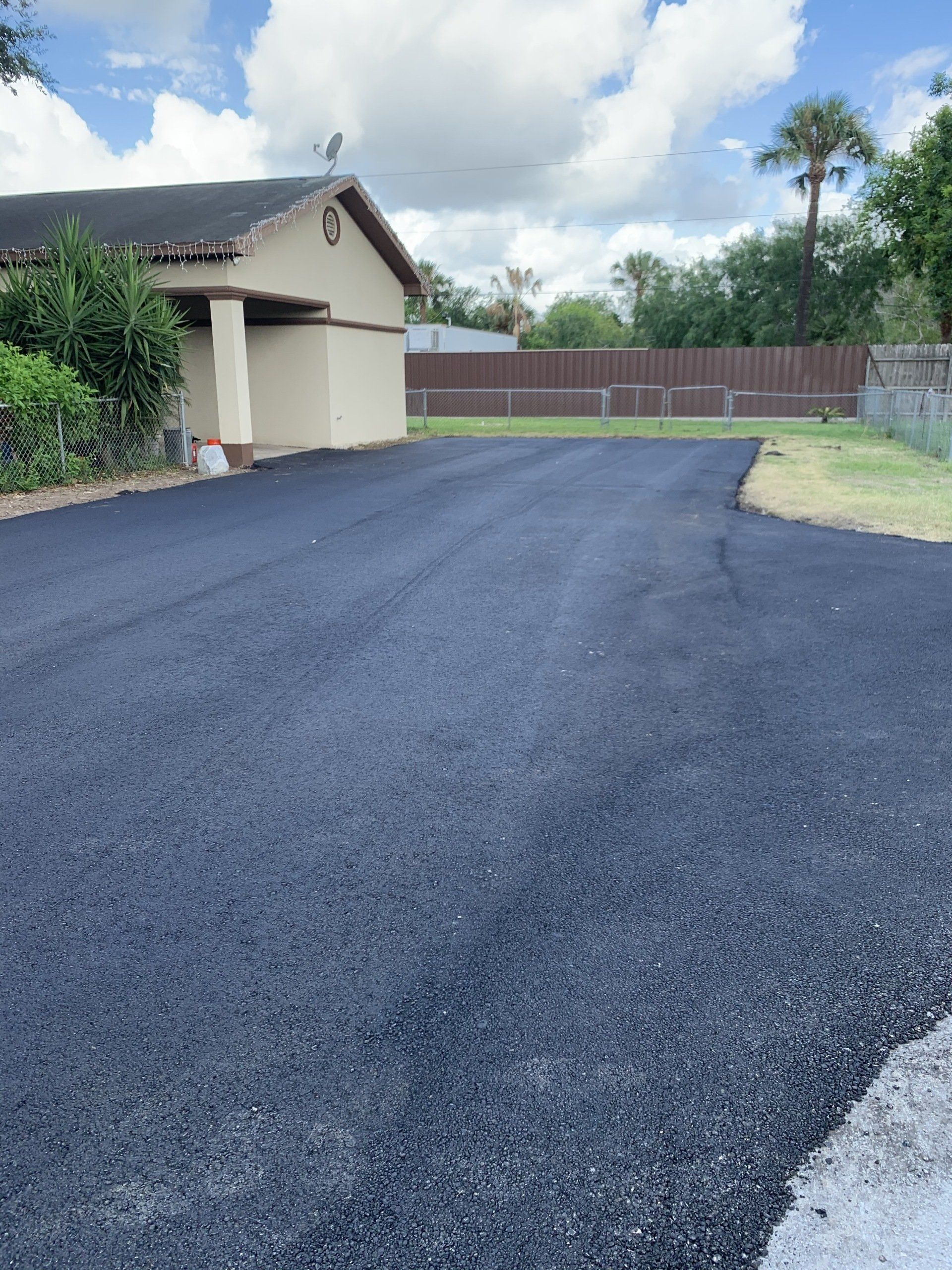 Residential house with wide driveway — Edinburg, TX — Lone Star Asphalt Services LLC