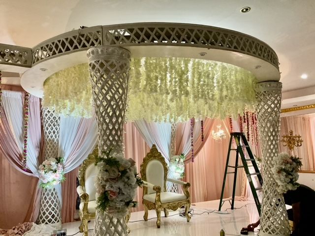 A room decorated for a wedding with a chair and a ladder.