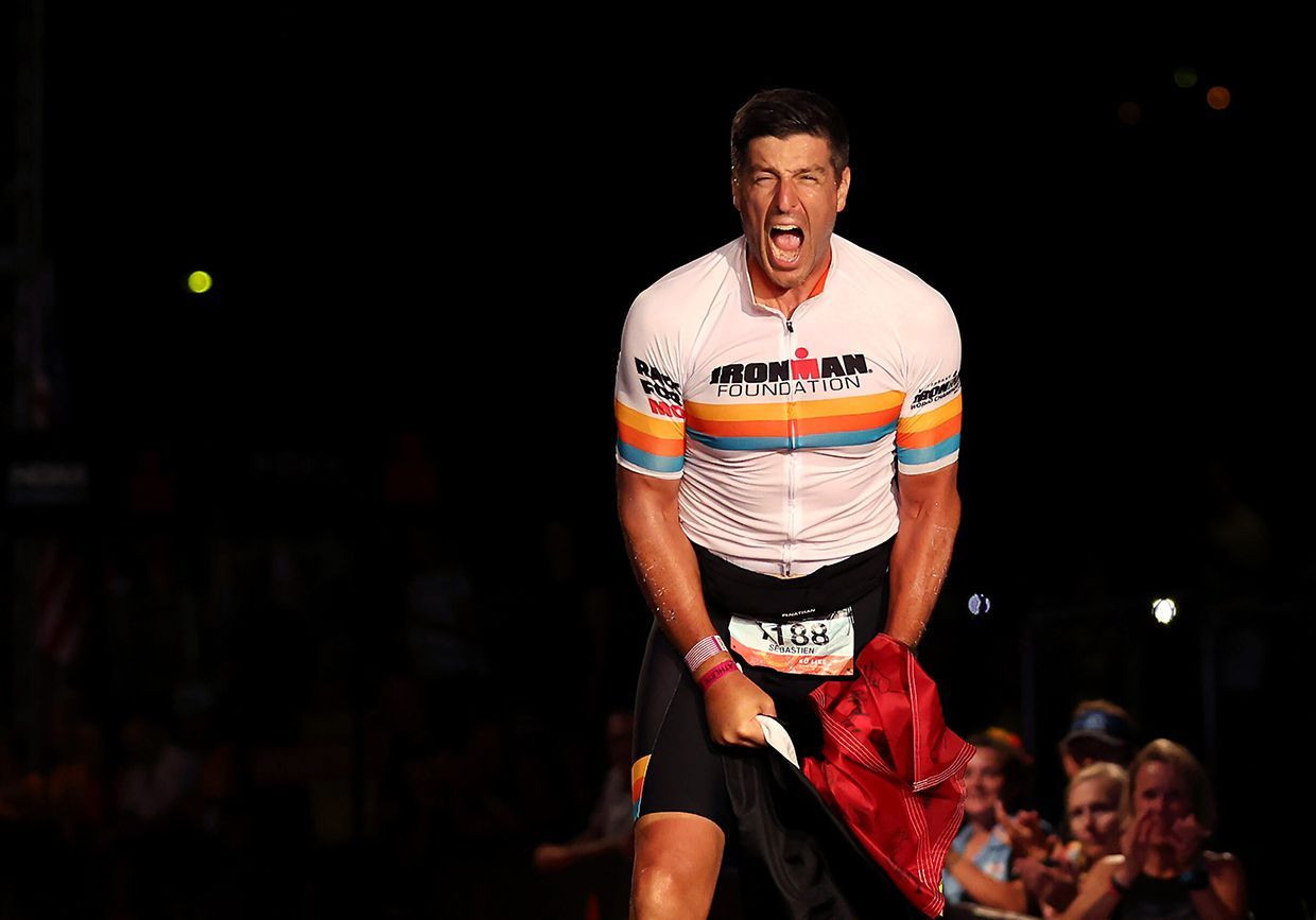 KAILUA KONA, HAWAII - OCTOBER 08: Sebastien Bellin of Belgium celebrates after finishing the IRONMAN World Championships on October 08, 2022 in Kailua Kona, Hawaii. (Photo by Ezra Shaw/Getty Images for IRONMAN)