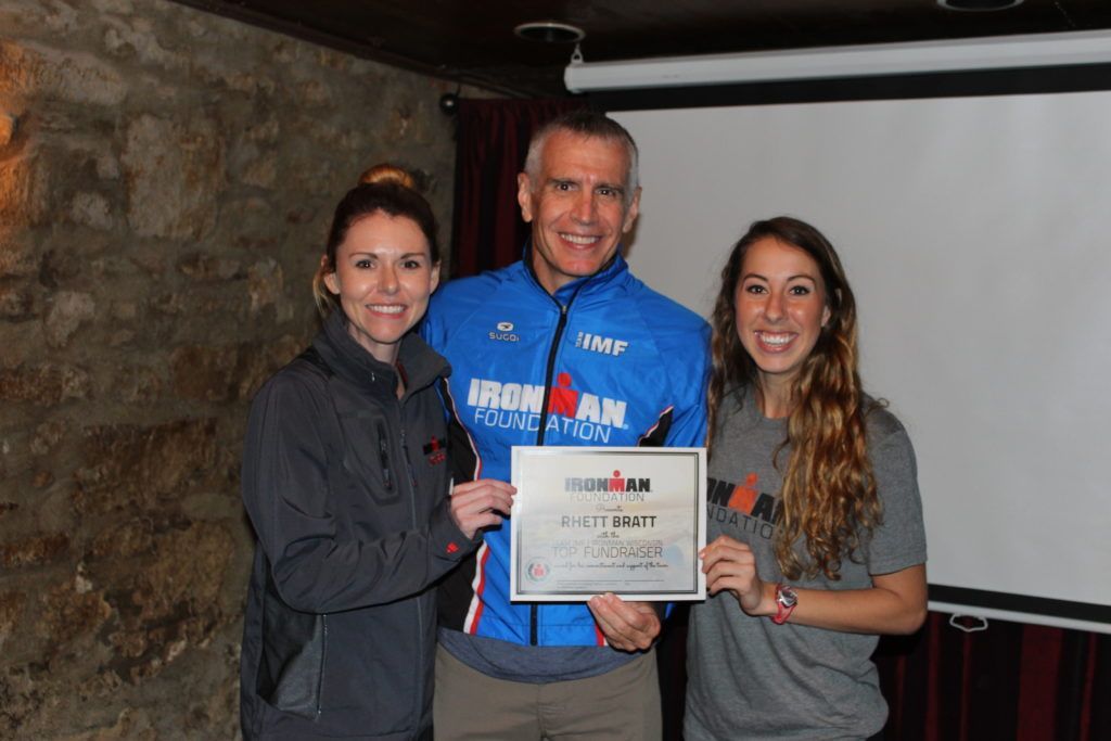 IMWI Top Fundraiser, Rhett Bratt, received a custom TEAM IMF Jacket, and a super sweet certificate for all of his incredible efforts! (Not pictured: Rhett also received an official IMWI Finisher's Jacket, 2 VIP Passes, and a $300 travel voucher)