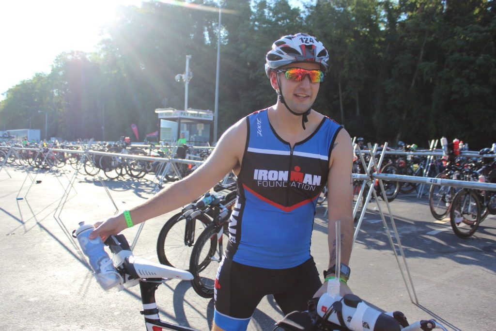 TEAM IMF Athlete, Joshua Case, grabs a drink before he hits the road for 114 miles.