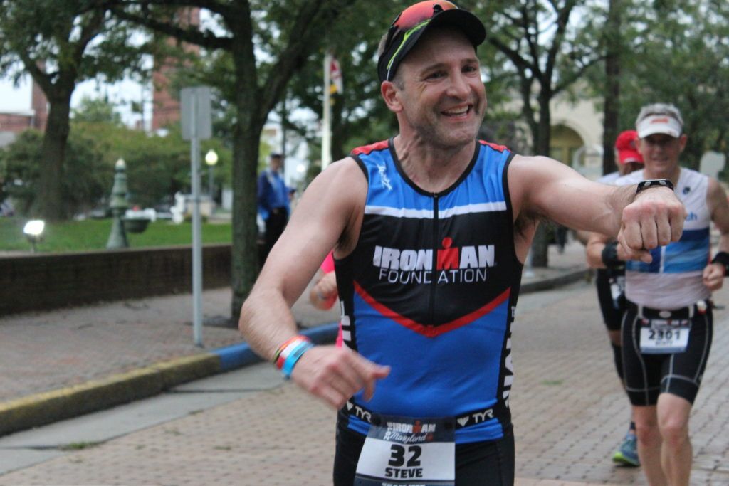 TEAM IMF Athlete, Steve Boyce, gives out free high fives on his 26.2 mile run.