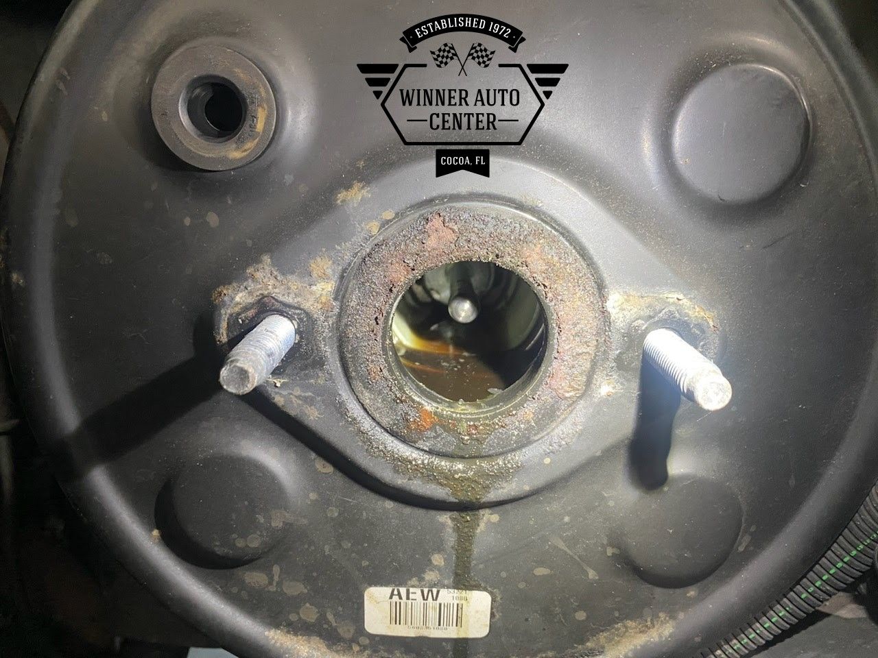 Close-up of a car's brake booster with exposed inner components | Winner Auto Center