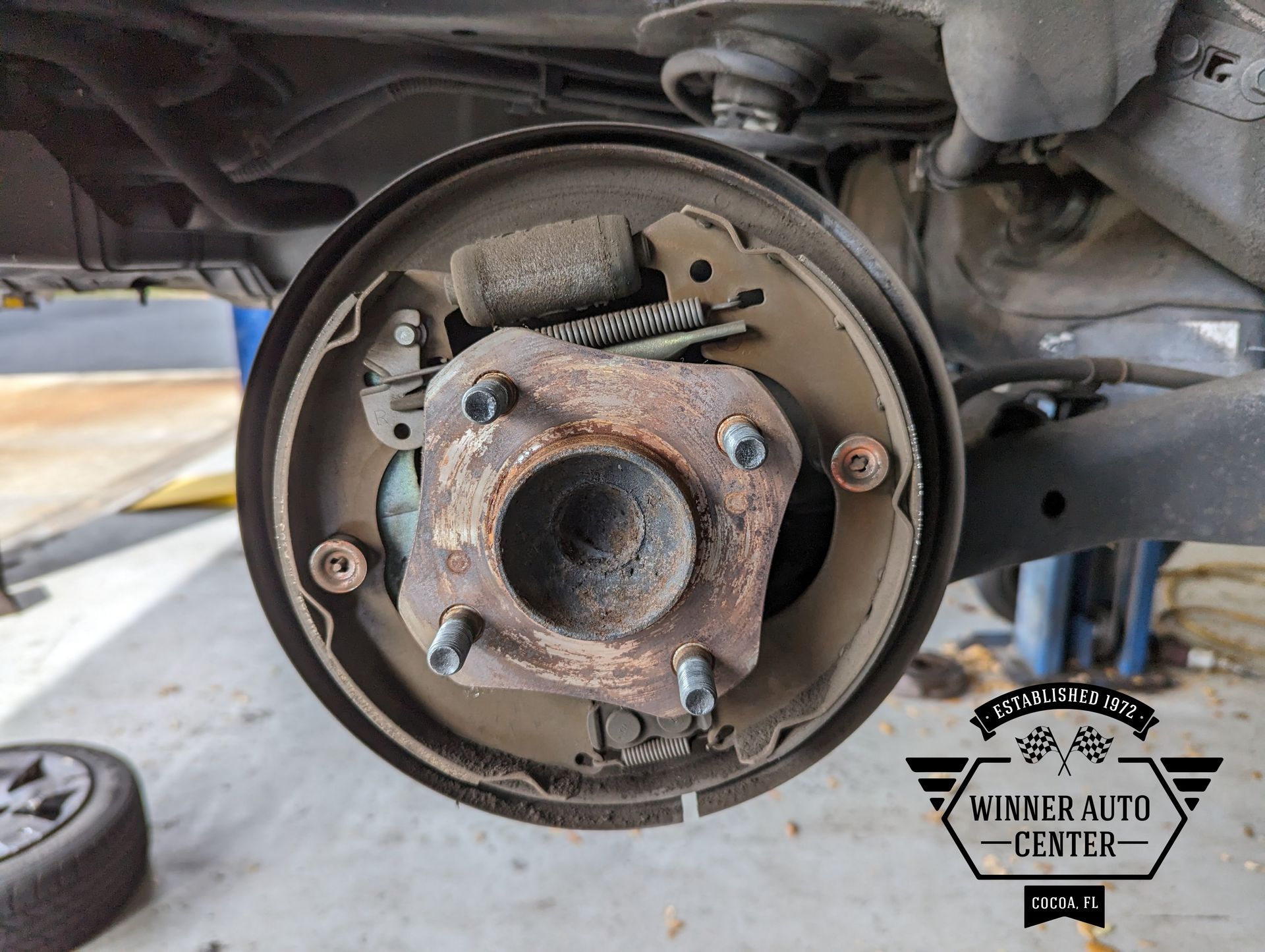Rear drum brake assembly, showing the hub, brake shoes, and other components | Winner Auto Center