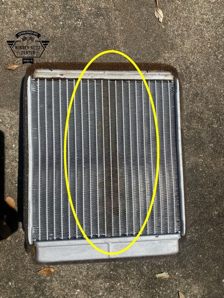 A close-up of a rectangular automotive heater core | Winner Auto Center
