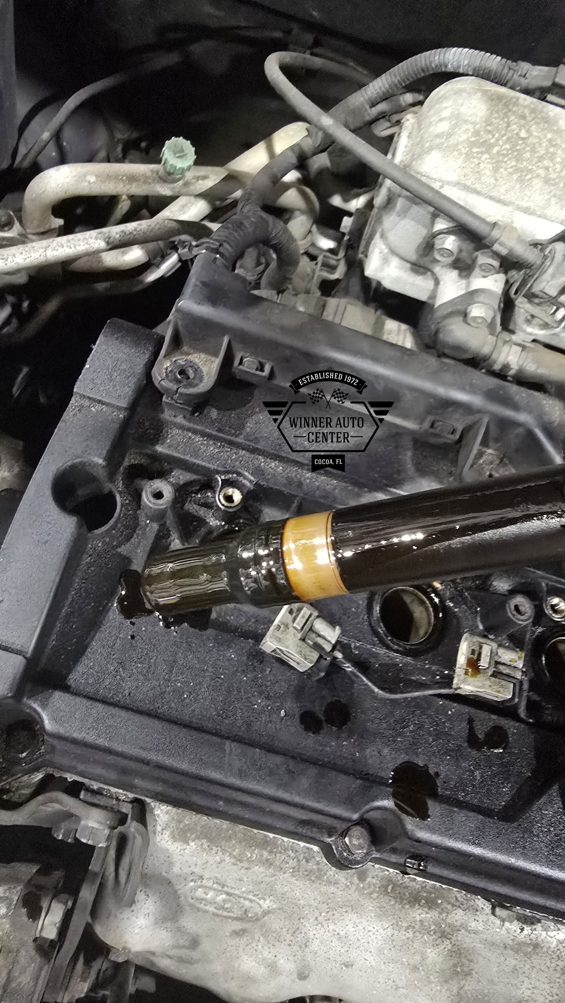 A car engine with the valve cover removed | Winner Auto Center
