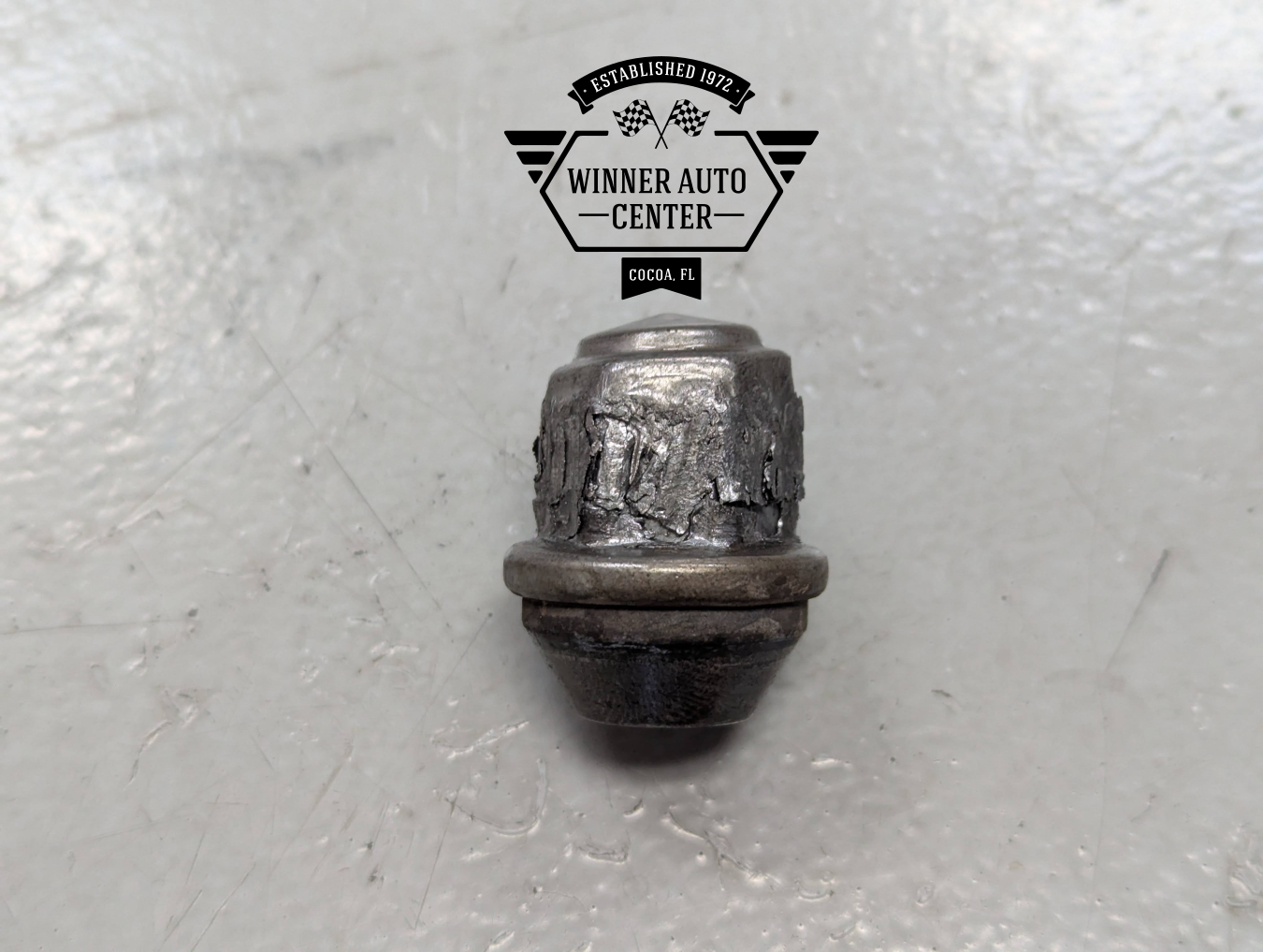 Damaged lug nut from a vehicle | Winner Auto Center