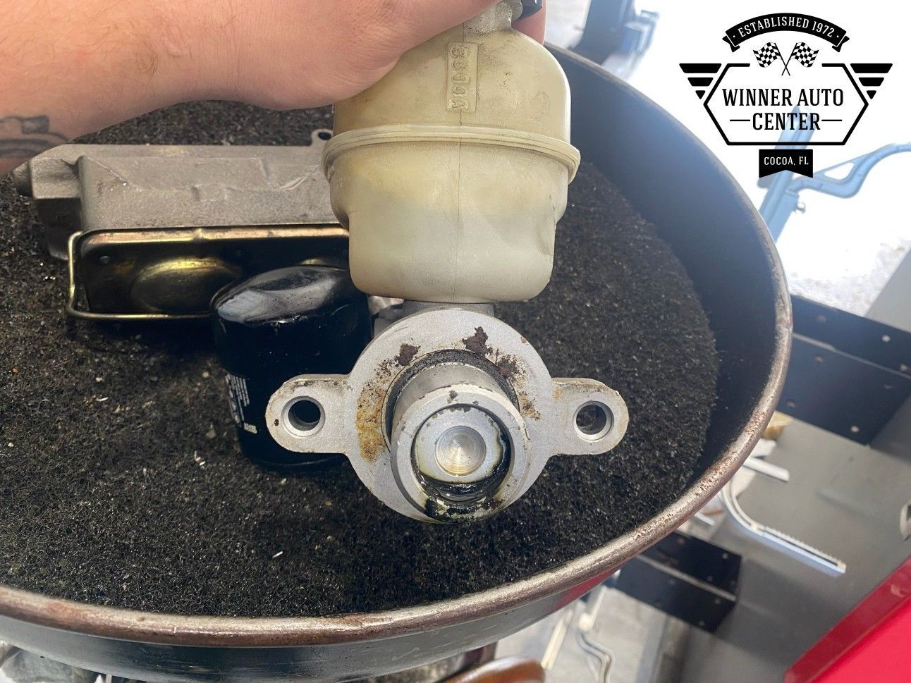 A car master cylinder being worked on | Winner Auto Center