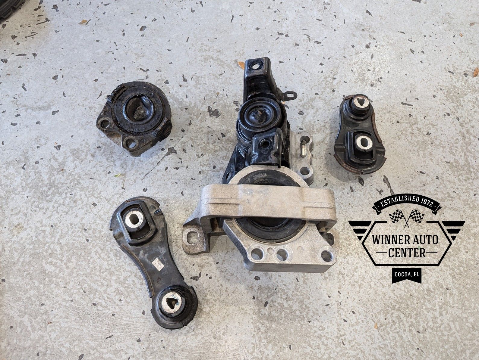A collection of used black and silver engine mounts | Winner Auto Center