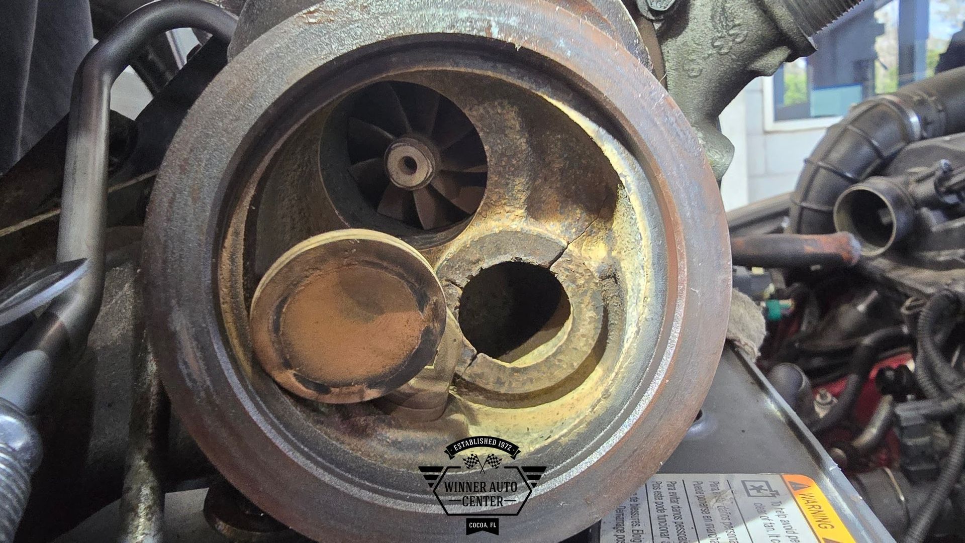 Close-up view of a corroded engine component | Winner Auto Center