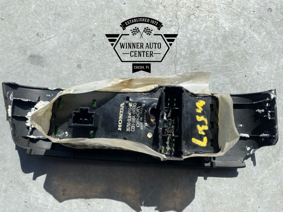 Black interior car panel with electrical components | Winner Auto Center