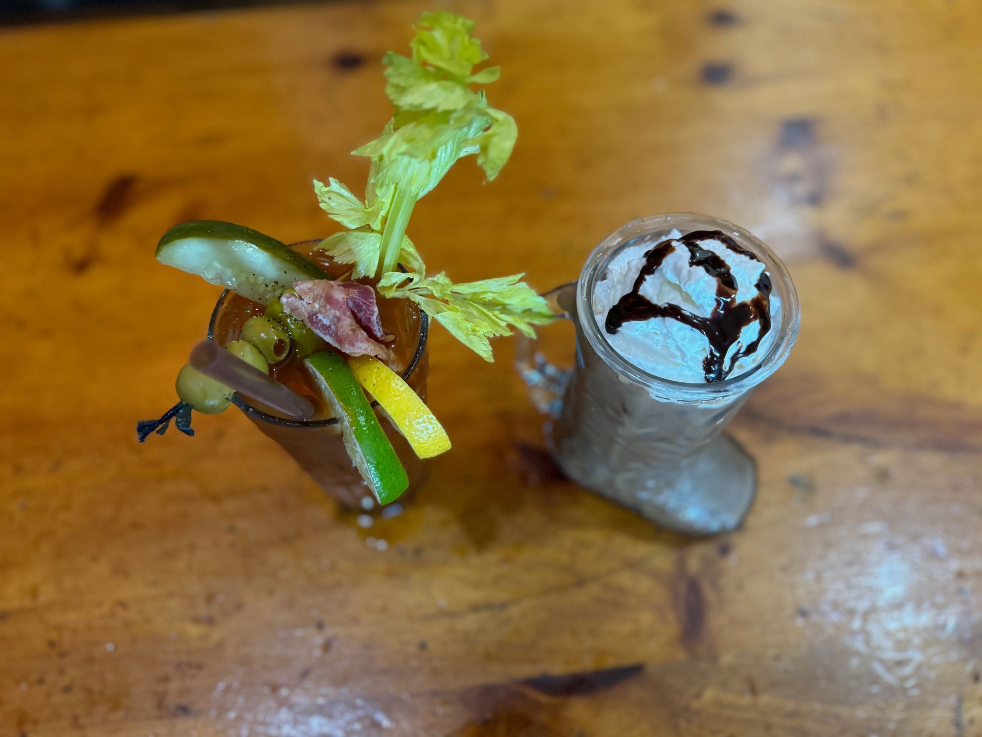 two cocktails on a wooden table