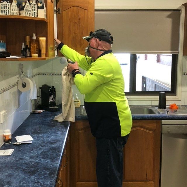 Pest Control Technician Spraying in Commercial Premises — Residential & Commercial Pest Control in Mackay, QLD