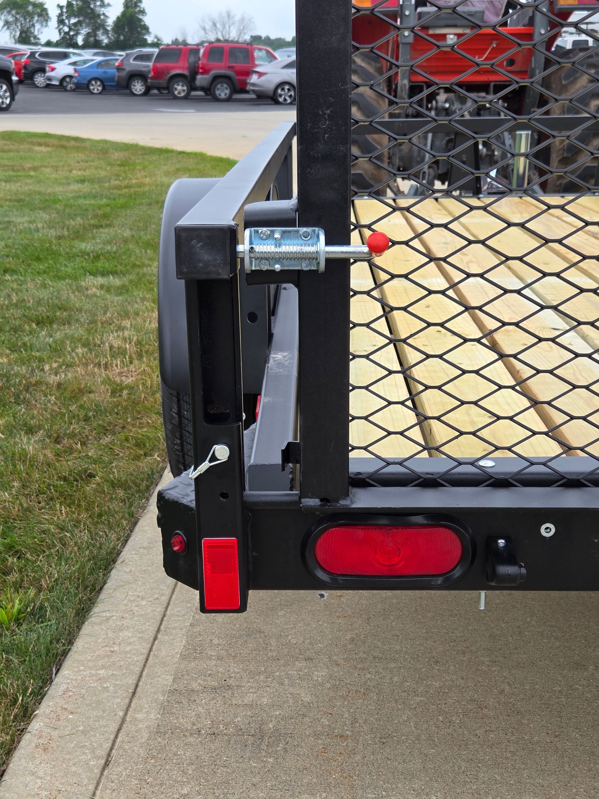 snap lock holding mesh trailer gate in upright position