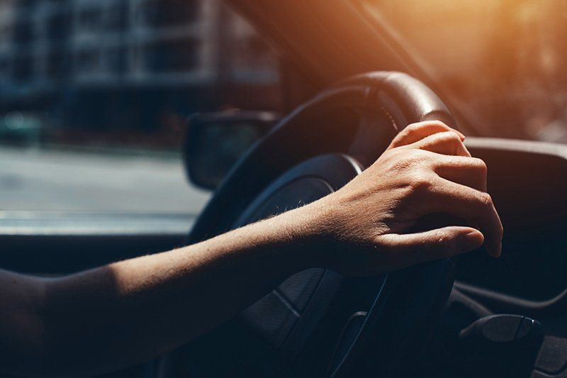 Hand Holding the Car Steering Wheel — Greenacres FL — Roy-Roth Agency